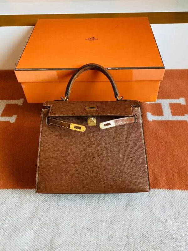 mmexport1691741490256-768x1024-1 Hermès Kelly rare wild Chevre Golden Brown Gold Hardware 25cm Full Handmade